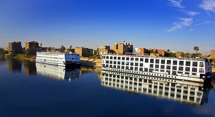 Two River Cruise Ships Passing On The River Nile